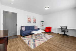 Living room with hardwood / wood-style flooring