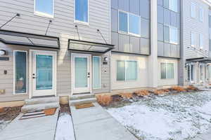 View of snow covered property entrance