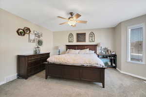 Bedroom featuring ceiling fan and light carpet