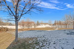 View of yard covered in snow