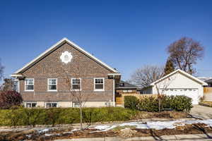 View of side of home featuring a garage