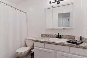 Bathroom featuring toilet and vanity