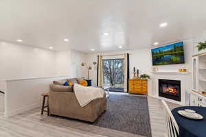 Living room with light hardwood / wood-style flooring