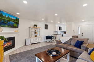 Living room with light hardwood / wood-style floors