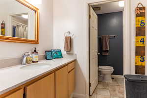 Bathroom featuring toilet and vanity