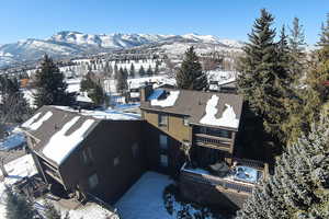 Snowy aerial view with a mountain view