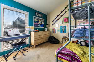 Bedroom featuring carpet flooring