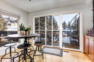 Dining area featuring a healthy amount of sunlight and light hardwood / wood-style floors