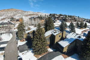 Snowy aerial view featuring a mountain view