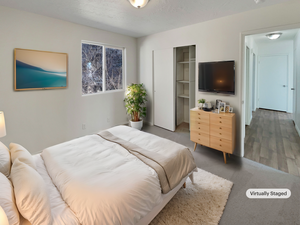 Bedroom featuring hardwood / wood-style flooring and a textured ceiling