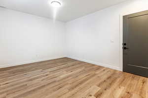 Spare room with light hardwood / wood-style floors