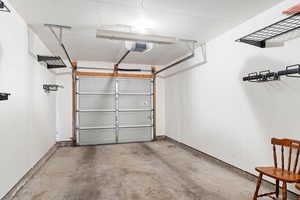 Garage featuring a garage door opener