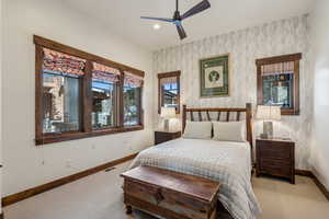 Bedroom featuring ceiling fan and light colored carpet