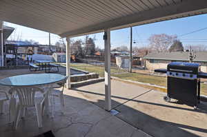 View of patio / terrace featuring a storage shed and area for grilling