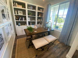 Office area featuring dark wood-type flooring