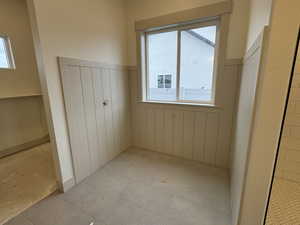 Unfurnished bedroom featuring a closet and light tile patterned flooring