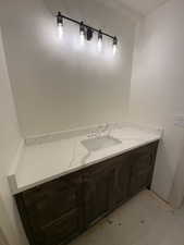 Bathroom with vanity and tile patterned flooring