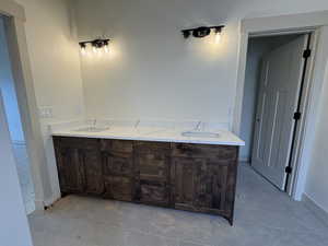 Bathroom featuring vanity and tile patterned flooring