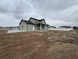 View of side of home with a patio area