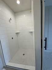 Bathroom featuring tiled shower