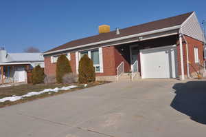 Ranch-style house featuring a garage