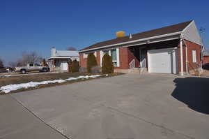 View of front facade featuring a garage