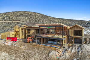 Back of house with a mountain view