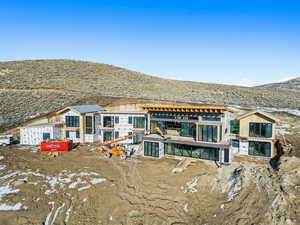 Back of house featuring a mountain view