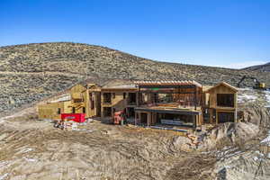 Rear view of property featuring a mountain view