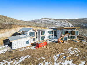 Rear view of house featuring a mountain view