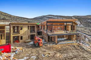 Rear view of property featuring a mountain view