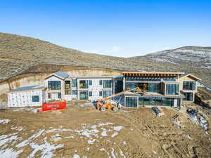 Back of property featuring a mountain view