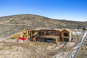 Back of house with a mountain view