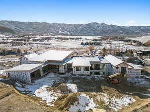 Snowy aerial view with a mountain view