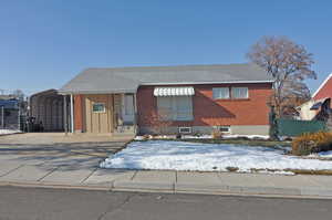 View of front facade featuring a carport