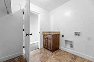 Laundry area featuring hookup for a washing machine and electric dryer hookup