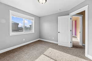 Unfurnished bedroom with carpet floors