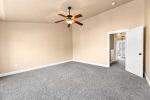 Spare room featuring carpet floors and ceiling fan