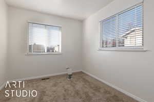 Empty room featuring carpet