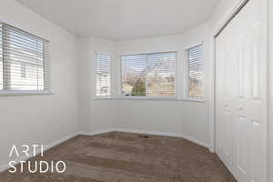 Unfurnished bedroom with carpet floors