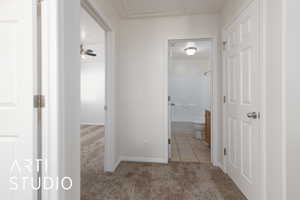 Hallway with light colored carpet