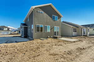 Rear view of house featuring a patio area