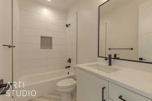 Full bathroom with toilet, tiled shower / bath, and vanity