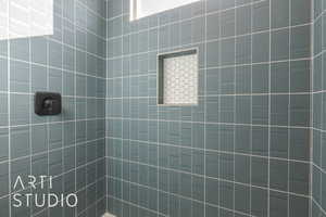 Bathroom featuring tiled shower