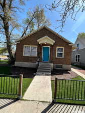 View of front of property with a front yard