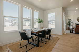 Dining space with recessed lighting, light wood-type flooring, and baseboards