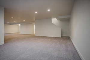 Bonus room with light colored carpet
