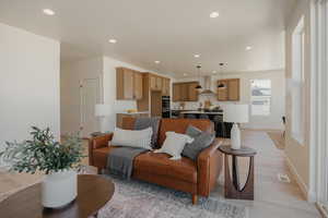 Living room featuring visible vents, light wood-style flooring, recessed lighting, and baseboards