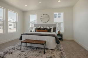 Carpeted bedroom featuring baseboards and recessed lighting