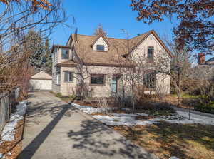 View of front of home featuring an outdoor structure and a garage